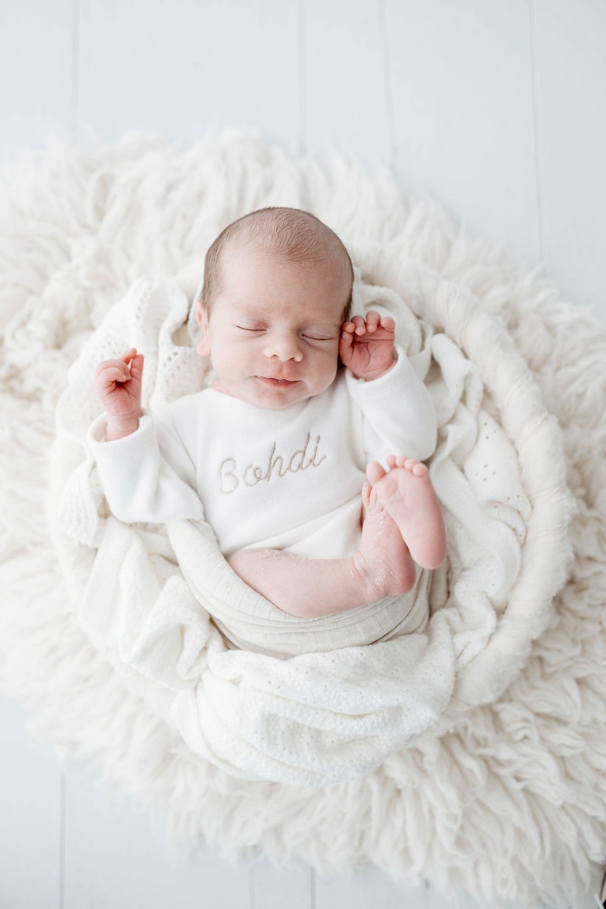 Newborn wearing a handmade personalised romper by Sweet Sews by Ann