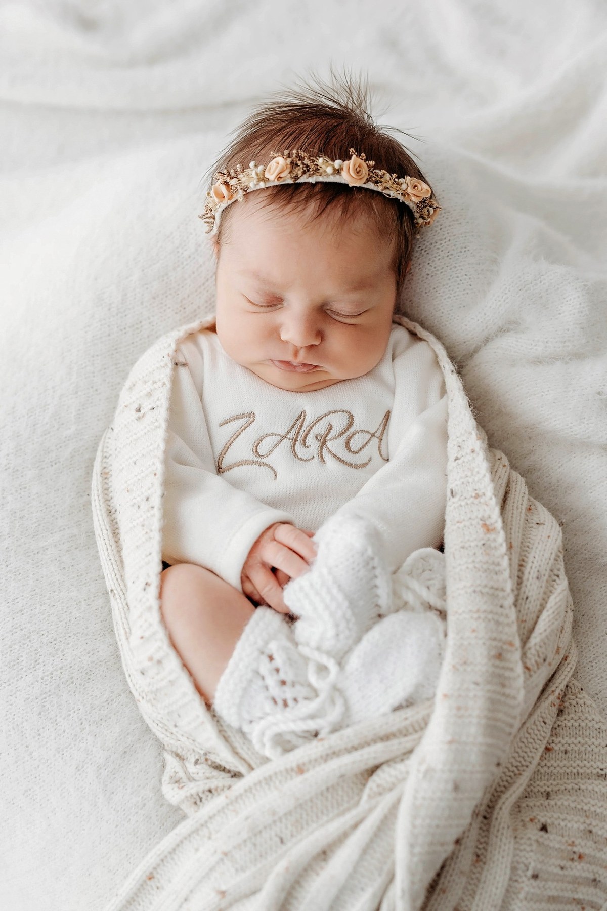 Newborn wearing a handmade personalised romper by Sweet Sews by Ann